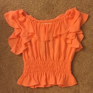 Orange top. Or crop top